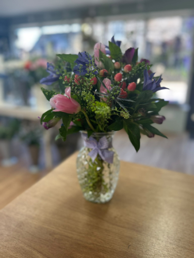 Spring Vase Arrangement - A charming vase arrangement featuring fresh seasonal flowers, perfect for bringing colour and elegance to any occasion.