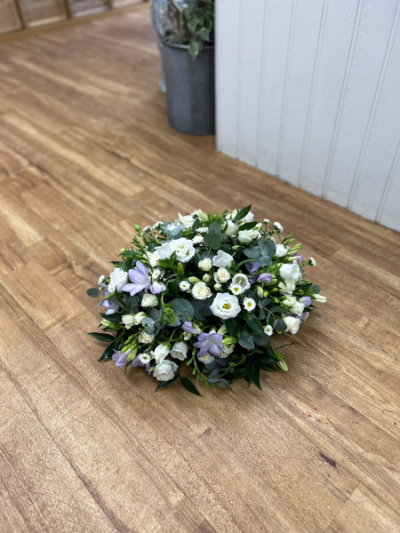 White Posy Arrangement - A classic white posy arrangement of fresh seasonal blooms, offering a timeless expression of sympathy and remembrance.