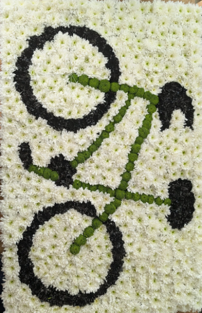 Bicycle Tribute - A bespoke floral bicycle tribute, handcrafted with intricate detail to celebrate a love of cycling or treasured memories of life on two wheels.